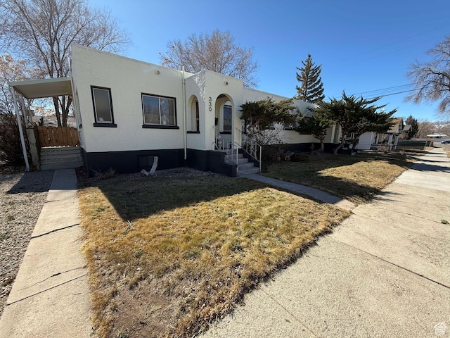 330 E 300 N, Price, UT 84501 - view of front of property with stucco siding and a front yard