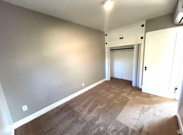 330 E 300 N, Price, UT 84501 - unfurnished bedroom featuring baseboards, a wall mounted air conditioner, a closet, and carpet