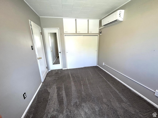 330 E 300 N, Price, UT 84501 - empty room featuring dark colored carpet, a wall mounted air conditioner, and baseboards