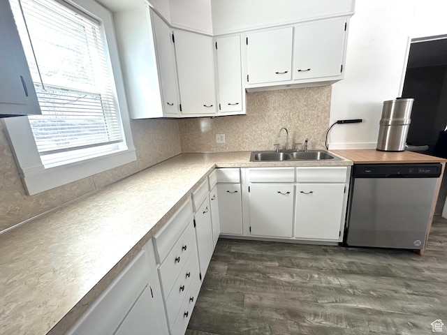 330 E 300 N, Price, UT 84501 - kitchen featuring stainless steel dishwasher, a sink, backsplash, light countertops, and white cabinets