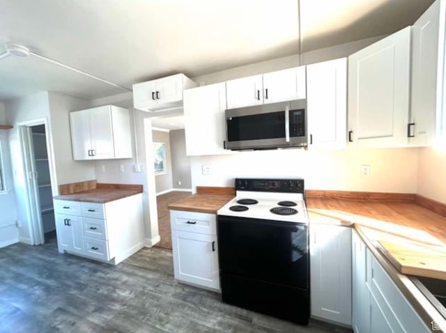 330 E 300 N, Price, UT 84501 - kitchen featuring dark wood-type flooring, stainless steel microwave, range with electric stovetop, and butcher block countertops