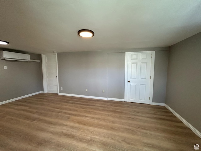 330 E 300 N, Price, UT 84501 - finished basement featuring baseboards, a wall mounted air conditioner, and wood finished floors