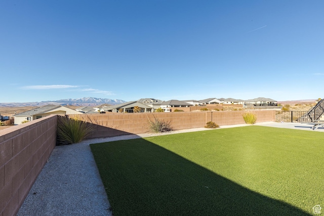 3311 E Barrel Roll Dr, St George, UT 84790 - view of yard featuring a fenced backyard, a residential view, and a mountain view