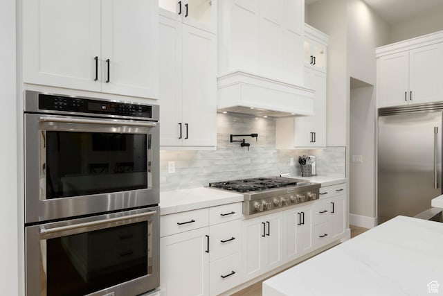 3311 E Barrel Roll Dr, St George, UT 84790 - kitchen featuring appliances with stainless steel finishes, white cabinetry, and light stone countertops