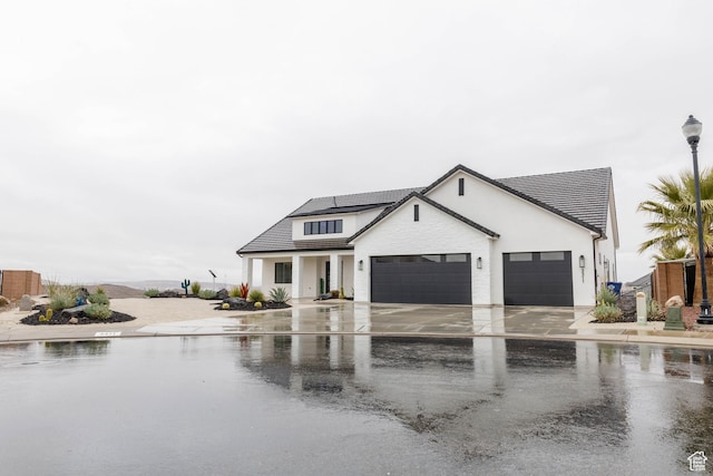 3311 E Barrel Roll Dr, St George, UT 84790 - modern farmhouse featuring a garage and concrete driveway