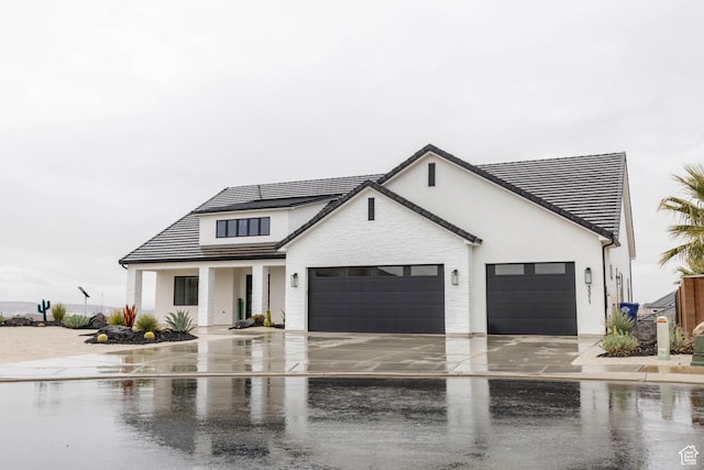 3311 E Barrel Roll Dr, St George, UT 84790 - modern farmhouse style home featuring a garage, driveway, and stucco siding