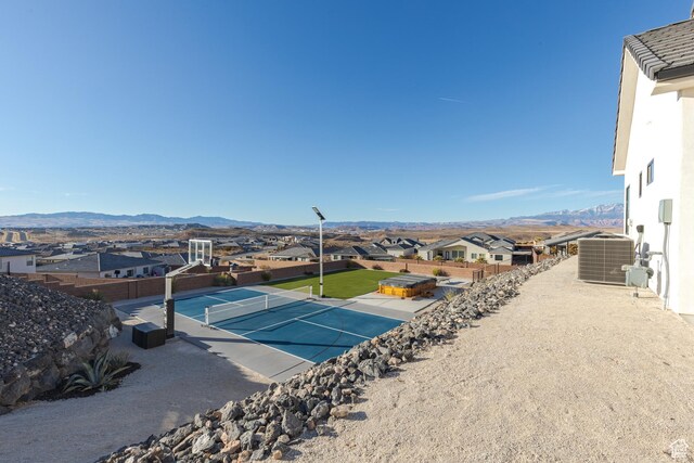 3311 E Barrel Roll Dr, St George, UT 84790 - exterior space with a mountain view, fence, and central AC unit