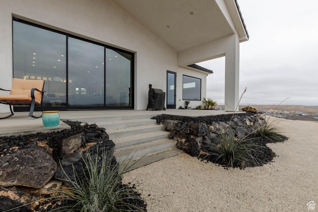 3311 E Barrel Roll Dr, St George, UT 84790 - entrance to property featuring a patio area and stucco siding