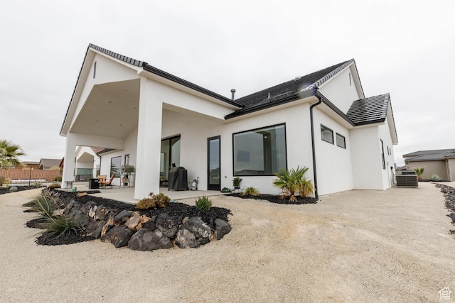 3311 E Barrel Roll Dr, St George, UT 84790 - back of property with cooling unit, a patio, fence, and stucco siding