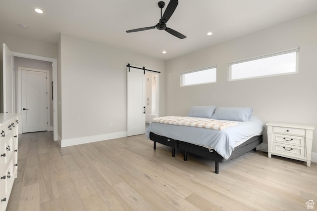 3311 E Barrel Roll Dr, St George, UT 84790 - bedroom featuring a barn door, recessed lighting, a ceiling fan, baseboards, and light wood finished floors