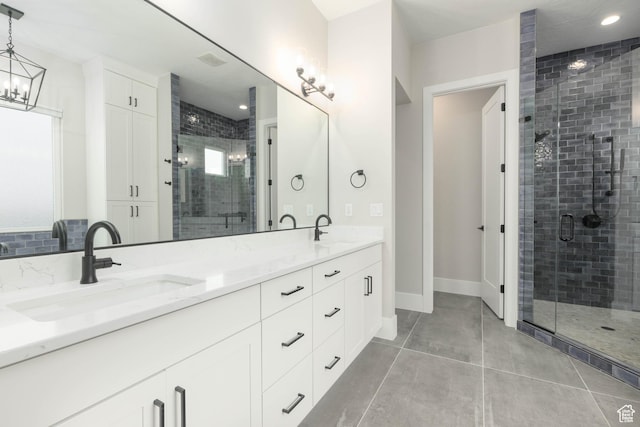 3311 E Barrel Roll Dr, St George, UT 84790 - full bath featuring double vanity, a stall shower, a sink, and tile patterned floors