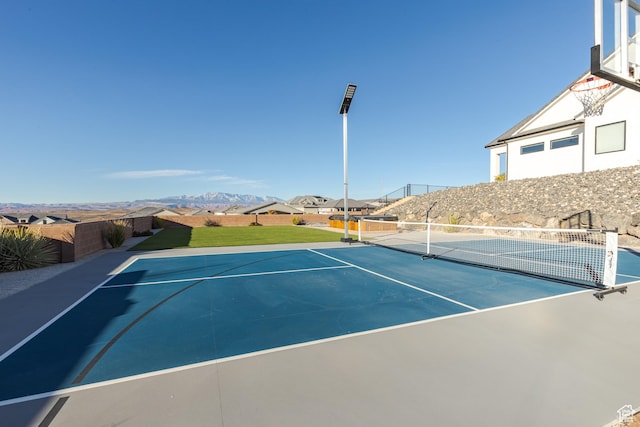 3311 E Barrel Roll Dr, St George, UT 84790 - view of tennis court with community basketball court, a residential view, a mountain view, and fence