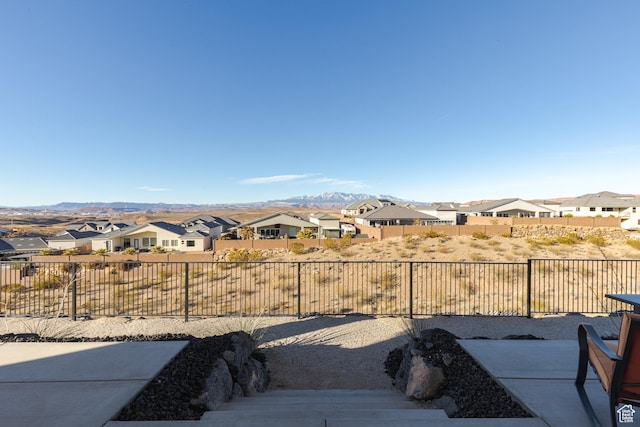 3311 E Barrel Roll Dr, St George, UT 84790 - view of yard featuring a residential view, a patio area, a fenced backyard, and a mountain view