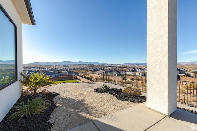 3311 E Barrel Roll Dr, St George, UT 84790 - view of patio / terrace with a residential view, a mountain view, and fence