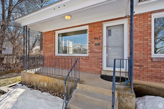 867 33rd St, Ogden, UT 84403 - view of exterior entry with covered porch and brick siding