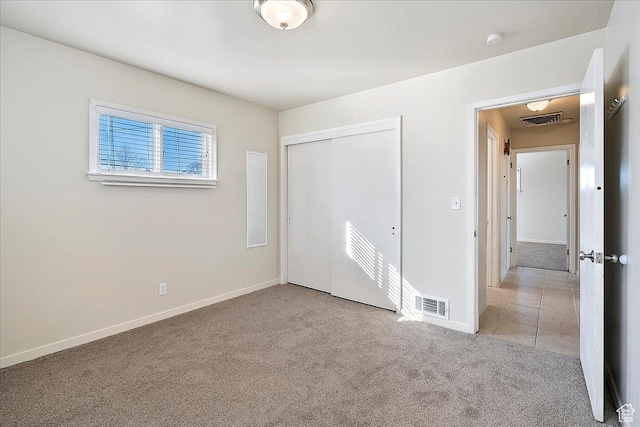 867 33rd St, Ogden, UT 84403 - unfurnished bedroom featuring light carpet, baseboards, visible vents, and a closet