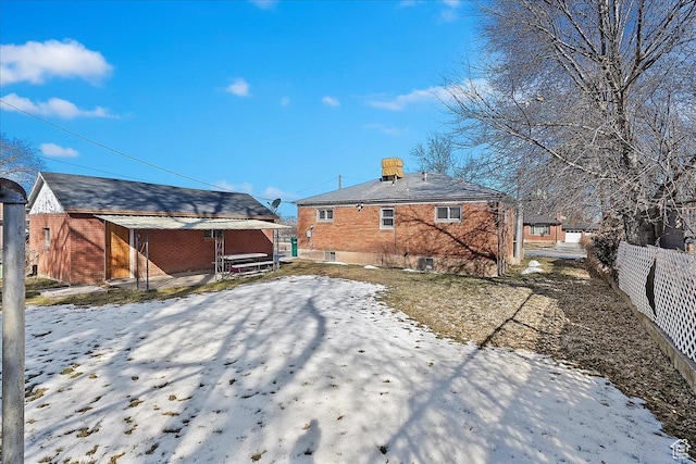 867 33rd St, Ogden, UT 84403 - snow covered property featuring brick siding and fence