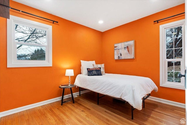 bedroom featuring recessed lighting, baseboards, and wood finished floors