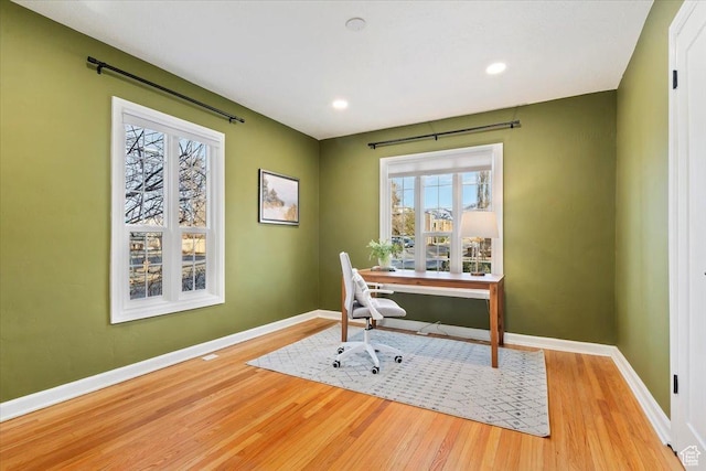 home office with light wood finished floors, baseboards, and recessed lighting