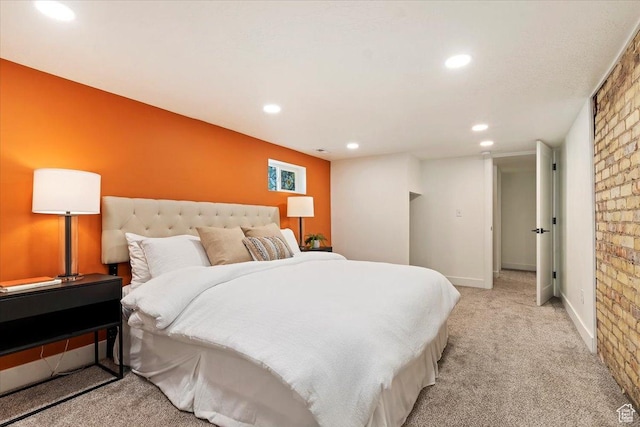 bedroom featuring light carpet, baseboards, and recessed lighting