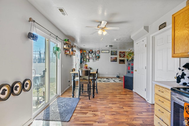 1486 S Archmore Loop, Springville, UT 84663 - kitchen featuring ceiling fan, visible vents, light countertops, and wood finished floors