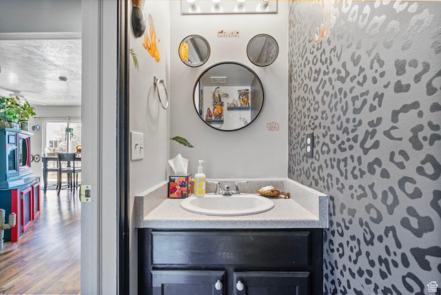 1486 S Archmore Loop, Springville, UT 84663 - bathroom with a textured ceiling, wood finished floors, and vanity