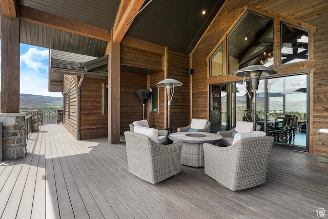 3203 E Kings Crest Ct, Heber City, UT 84032 - wooden terrace with a mountain view and an outdoor living space with a fire pit