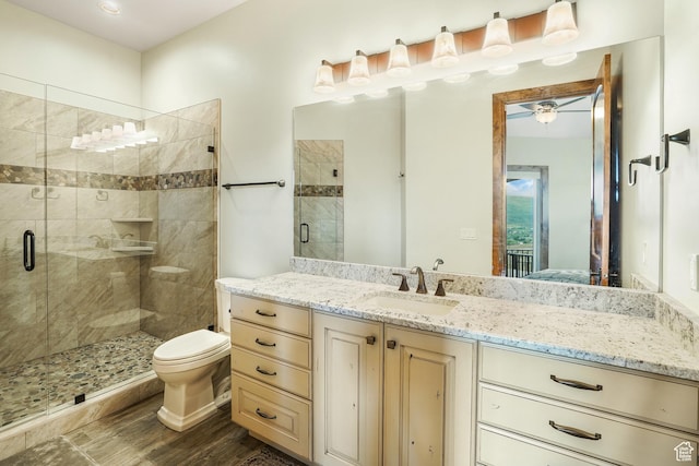 3203 E Kings Crest Ct, Heber City, UT 84032 - bathroom with toilet, wood finished floors, a shower stall, and vanity