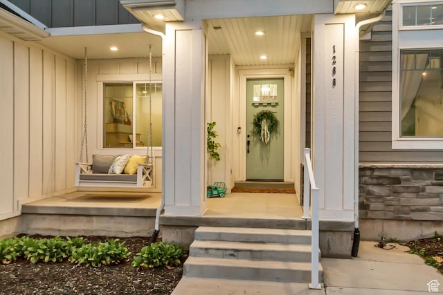 1288 S Red Filly Rd, Heber City, UT 84032 - doorway to property with stone siding, covered porch, and board and batten siding