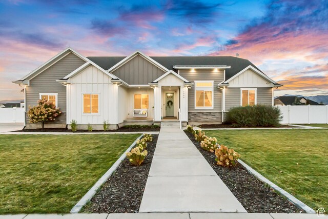 1288 S Red Filly Rd, Heber City, UT 84032 - view of front of home with a lawn, fence, and board and batten siding