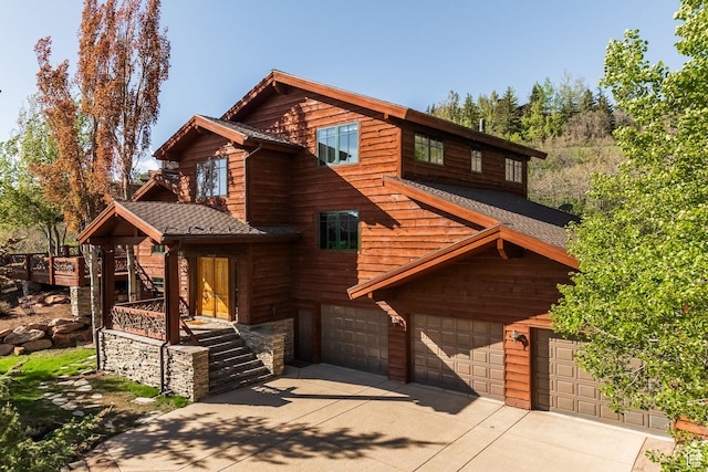 2667 Aspen Springs Dr, Park City, UT 84060 - rustic home featuring driveway, a garage, and roof with shingles