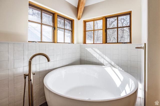 2667 Aspen Springs Dr, Park City, UT 84060 - full bath featuring tile walls, a freestanding tub, and wainscoting