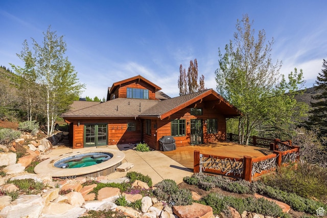 2667 Aspen Springs Dr, Park City, UT 84060 - rear view of house with an in-ground hot tub, a deck, and a patio