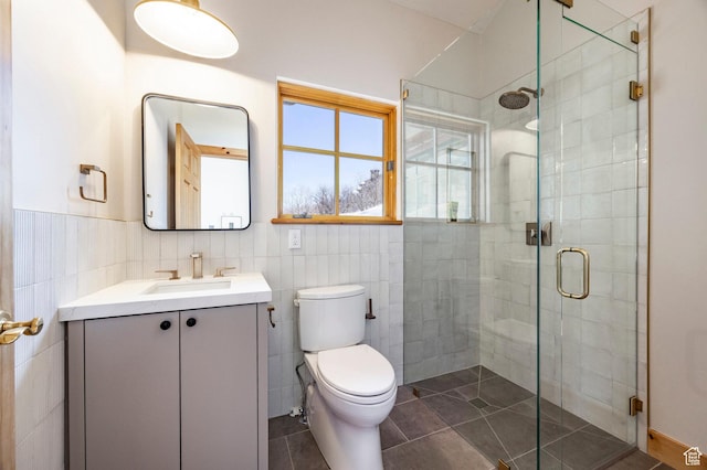 2667 Aspen Springs Dr, Park City, UT 84060 - full bath featuring tile walls, vanity, a shower stall, toilet, and tile patterned floors
