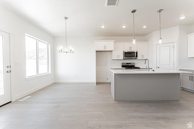712 W 4500 S Unit 304, Mapleton, UT 84664 - kitchen featuring stainless steel appliances, recessed lighting, light countertops, a sink, and light wood-style flooring