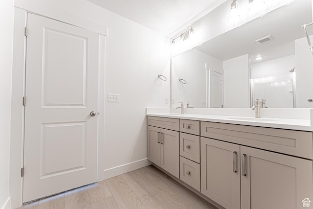 712 W 4500 S Unit 304, Mapleton, UT 84664 - bathroom with double vanity, baseboards, and a shower