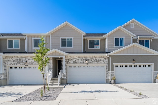 712 W 4500 S Unit 304, Mapleton, UT 84664 - view of front facade with a garage, concrete driveway, and stone siding