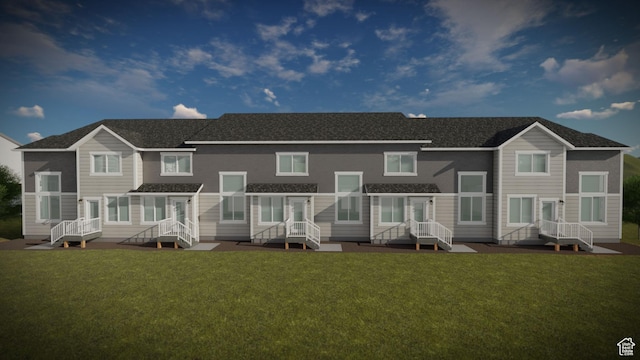 back of house featuring a lawn