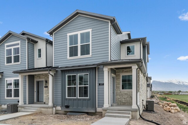 1819 N 3530 W, Lehi, UT 84043 - view of front facade with stone siding, a mountain view, and central AC