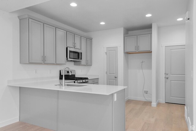 1819 N 3530 W, Lehi, UT 84043 - kitchen with baseboards, appliances with stainless steel finishes, gray cabinetry, and light wood-style floors