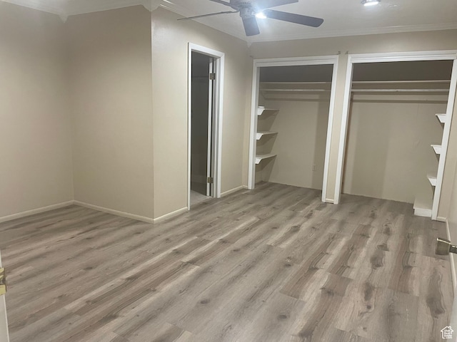 1502 S 325 W, Hurricane, UT 84737 - unfurnished bedroom with light wood-type flooring, a ceiling fan, and multiple closets