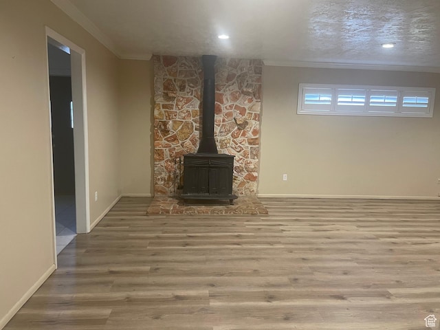 1502 S 325 W, Hurricane, UT 84737 - unfurnished living room with baseboards, wood finished floors, a wood stove, and crown molding