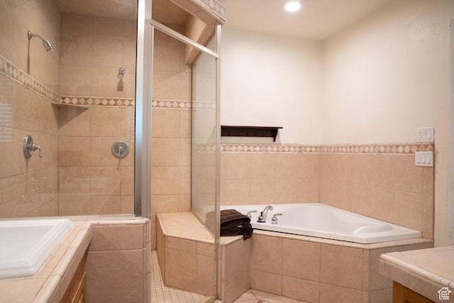 1502 S 325 W, Hurricane, UT 84737 - bathroom featuring a stall shower, tile patterned flooring, a bath, and recessed lighting