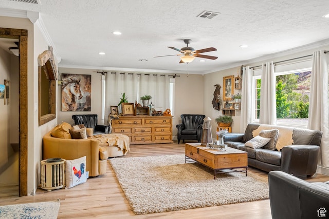 1502 S 325 W, Hurricane, UT 84737 - living room featuring a textured ceiling, light wood-style floors, visible vents, and crown molding