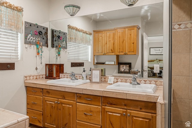 1502 S 325 W, Hurricane, UT 84737 - kitchen featuring tile countertops, brown cabinetry, and a sink