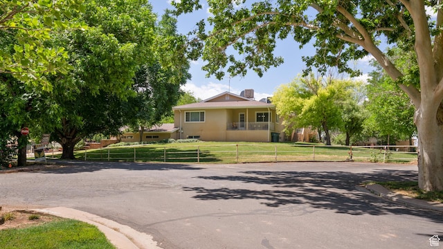 1502 S 325 W, Hurricane, UT 84737 - view of front facade with a front lawn, a chimney, fence, and stucco siding