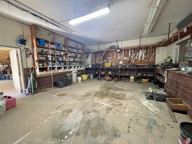 1502 S 325 W, Hurricane, UT 84737 - garage featuring a workshop area and concrete block wall