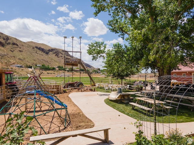 1502 S 325 W, Hurricane, UT 84737 - view of playground featuring a mountain view, an exterior structure, and a rural view