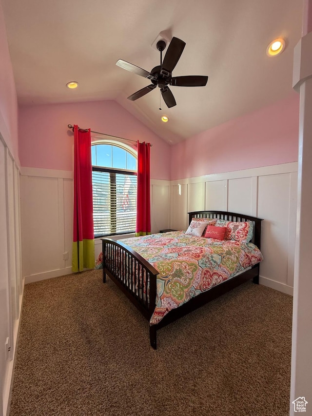 5818 Cambridge Dr, Mountain Green, UT 84050 - carpeted bedroom featuring vaulted ceiling, a ceiling fan, a wainscoted wall, and a decorative wall