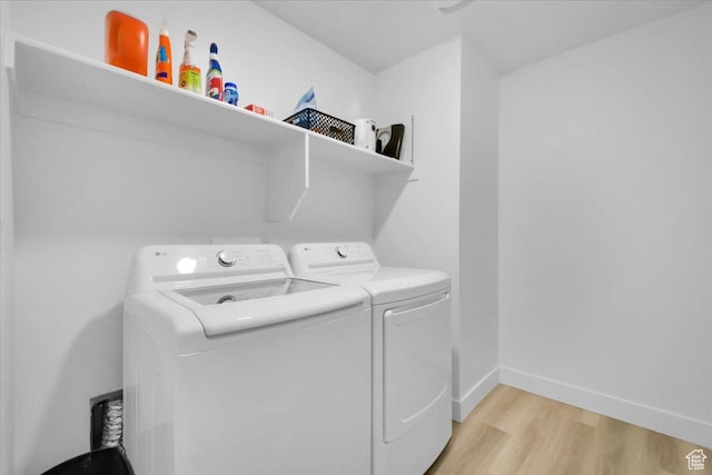 916 N 1190 E, Spanish Fork, UT 84660 - clothes washing area featuring laundry area, light wood-style flooring, baseboards, and separate washer and dryer